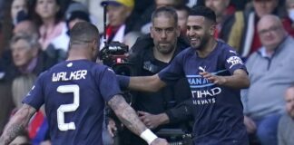 Riyad Mahrez (right) Manchester City celebrates scoring his team's fourth goal in the match