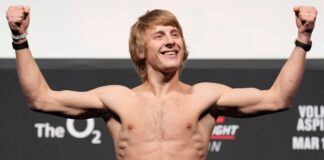 Paddy Pimblett of England poses on the scale during the UFC Fight Night ceremonial weigh-in at O2 Arena 
