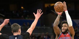 Detroit Pistons forward Saddiq Bey shoots in front of Orlando Magic forward Franz Wagner 